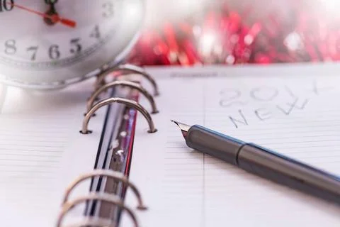 Pen on New Year s diary black fountain pen lying on the diary on the eve o... 스톡 사진