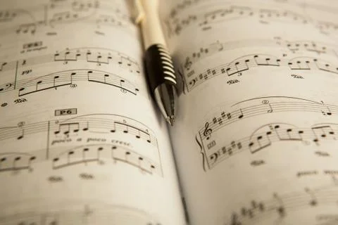Pen on the note book Stock Photos