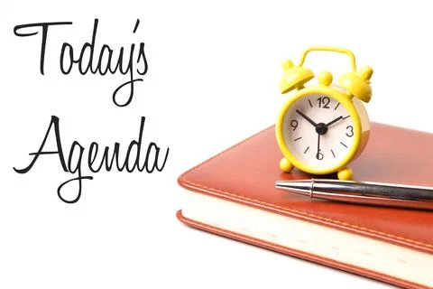 Pen, notebook and clock over white background with text TODAY'S AGENDA. Busin Stock Photos