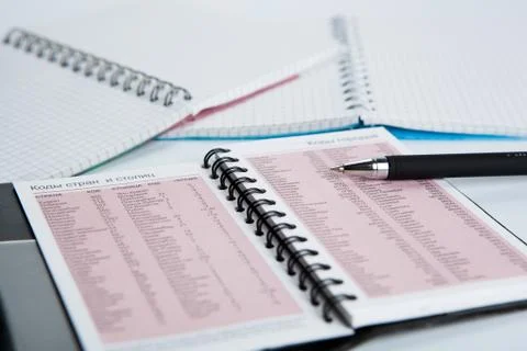 Pen on notebook page with text Stock Photos