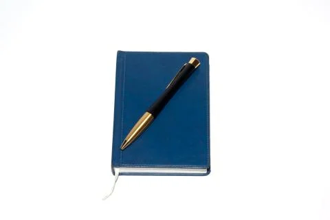 Pen on notebook Stock Photos