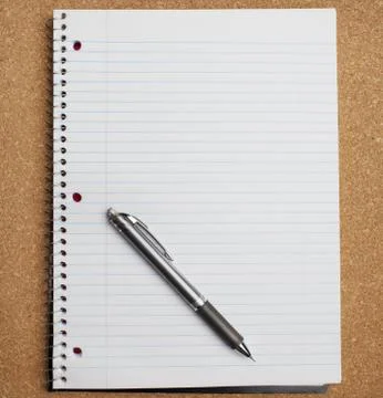 Pen on notebook Stock Photos
