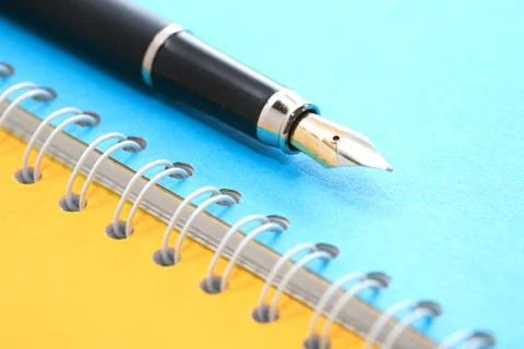 Pen On Notebook Stock Photos