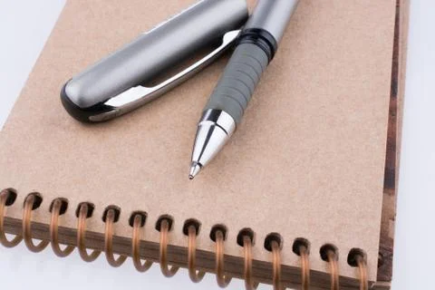 Pen on a notebook Stock Photos