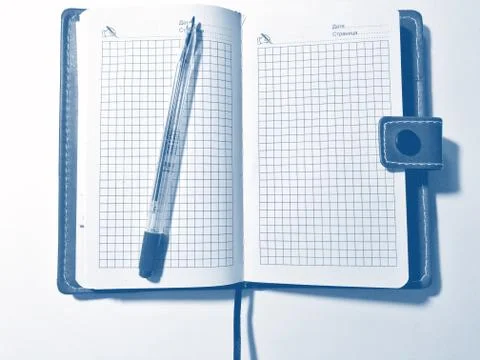 Pen with notebook on white background. PANTONE Blue, Classic Blue, Phantom Bl Stock Photos