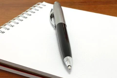 Pen on the notepad Stock Photos