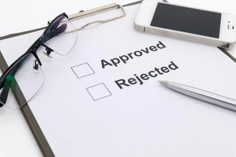 Pen over document, select Approved or Rejected. Stock Photos