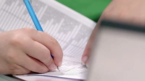Pen on the page, information engage, data on paper sets the stage Stock Footage 320925239