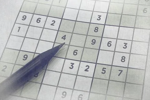 Pen on Partially Solved Sudoku Puzzle Stock Photos