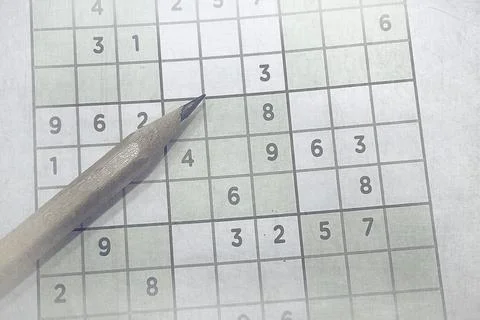 Pen on Partially Solved Sudoku Puzzle Stock Photos