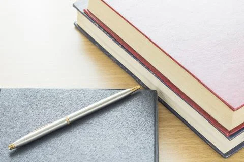 Pen put on notebook Stock Photos