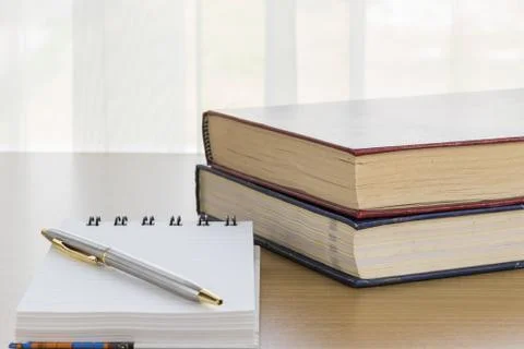 Pen put on notepad open blank page Stock Photos