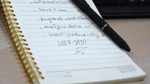 Pen Resting On AI Strategy Plan Notebook Stock Footage 341396149
