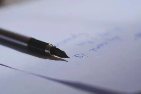Pen is sharp on white sheets of paper Stock Photos