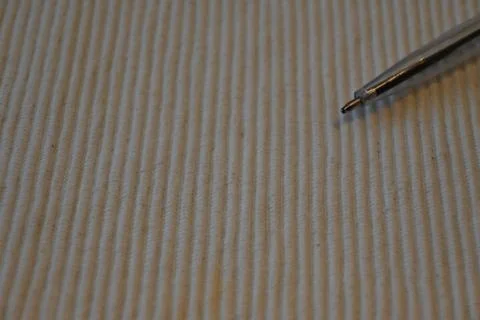 Pen tip over textured fabric Photos