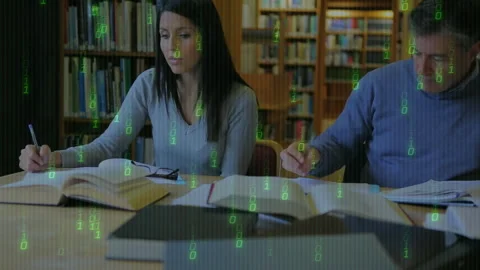 Pen touching page activating floating green code while study partners writing Stock Footage 312280103