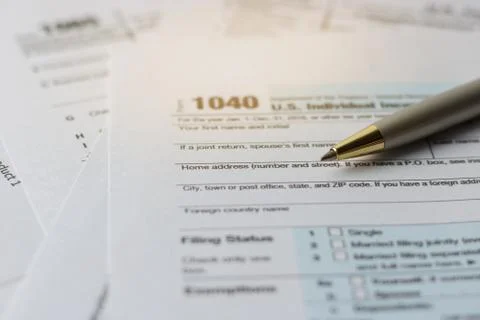 Pen on us tax form 1040 Stock Photos