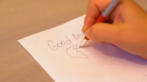 Pen write a farewell letter with a broken heart 4K Stock Footage 102636402