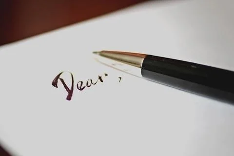 Pen to write a letter dear Stock Photos