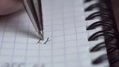 Pen writes a letter on paper. Closeup. Shallow depth of field Stock Footage 69211325
