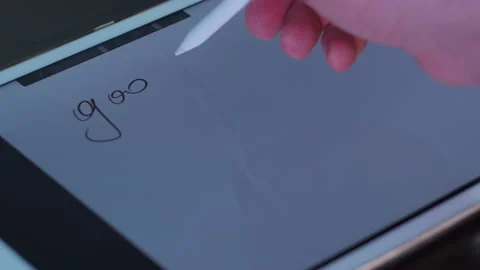 Pen writes text on the tablet. good luck Stock Footage 146909656