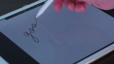 Pen writes text on the tablet. good luck Stock Footage 147037996