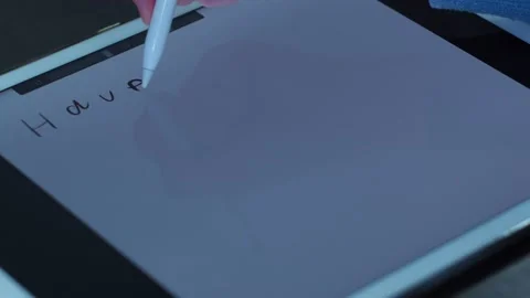 Pen writes text on the tablet. have a good time Stock Footage 146735741