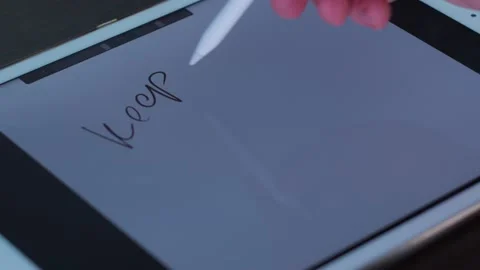 Pen writes text on the tablet. keep well. stop covid Stock Footage 146976848