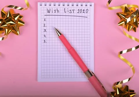 Pen writing in empty notebook decorated with Christmas decorations on the pin Stock Photos