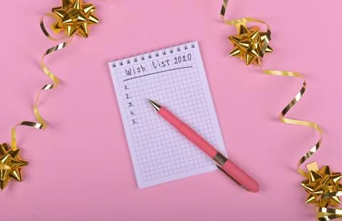 Pen writing in empty notebook decorated with Christmas decorations on the pin Stock Photos