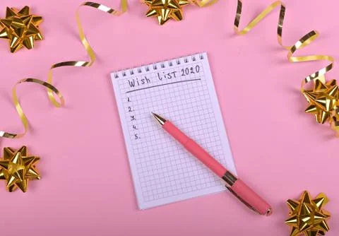 Pen writing in empty notebook decorated with Christmas decorations on the pin Stock Photos