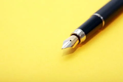 Pen On Yellow Stock Photos