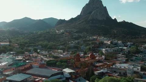 Pena de Bernal monolith and San Sebastian Bernal village in Mexico in aerial Видео 335199923