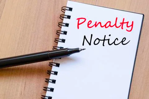 Penalty notice write on notebook Stock Photos