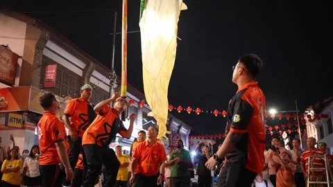 Penang flag chingay performance at street while crowds gather Video stock 346245384