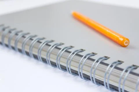 A pencil and a book Stock Photos