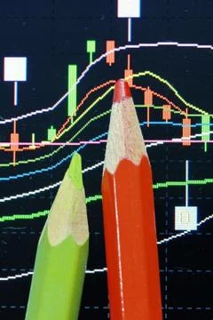 Pencil and candlestick chart Stock Photos