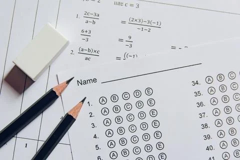 Pencil and eraser on answer sheets or Standardized test form with answers b.. Stock Photos