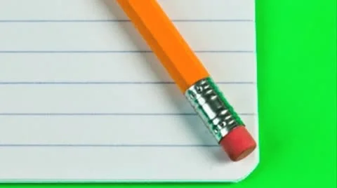 Pencil and eraser on a lined pad of paper Stock Footage 21304571