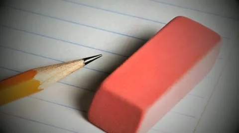 Pencil and eraser on a lined pad of paper Stock Footage 21305601