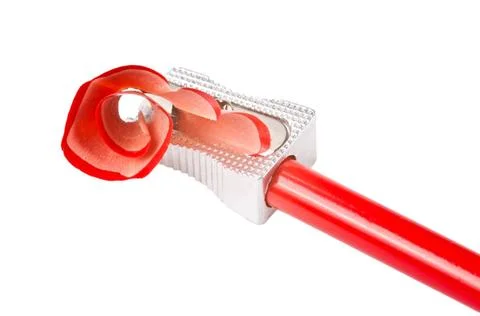 Pencil and Sharpener A red sharp pencil being sharpened by a pencil sharpe... 스톡 사진
