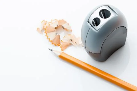 Pencil and sharpner on white background. Stock Photos