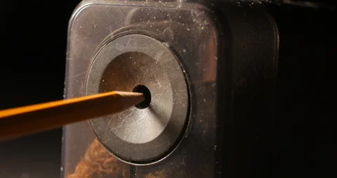 Pencil being sharpened in a pencil sharpener Stock Footage 105949086