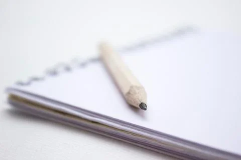 Pencil on a book Stock Photos