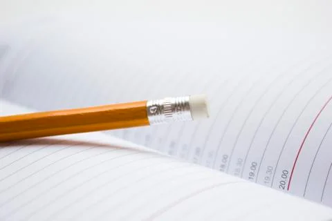 Pencil on a book Stock Photos