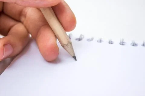 Pencil on a book Stock Photos