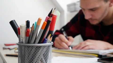 Pencil case in the blurred background man artist draws a sketch Stock Footage 103101447