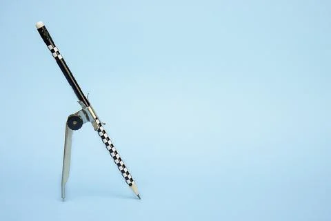 Pencil with compass on blue background with copy space Stock Photos