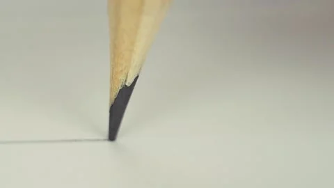 A pencil draws on paper. A sharp pencil draws a line on the paper. Video stock 154556679