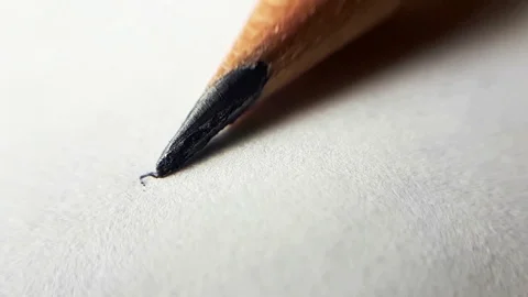 The Pencil Draws Uneven Random Lines on a White Paper. Macro Close Up Shot. Stock Footage 97497595